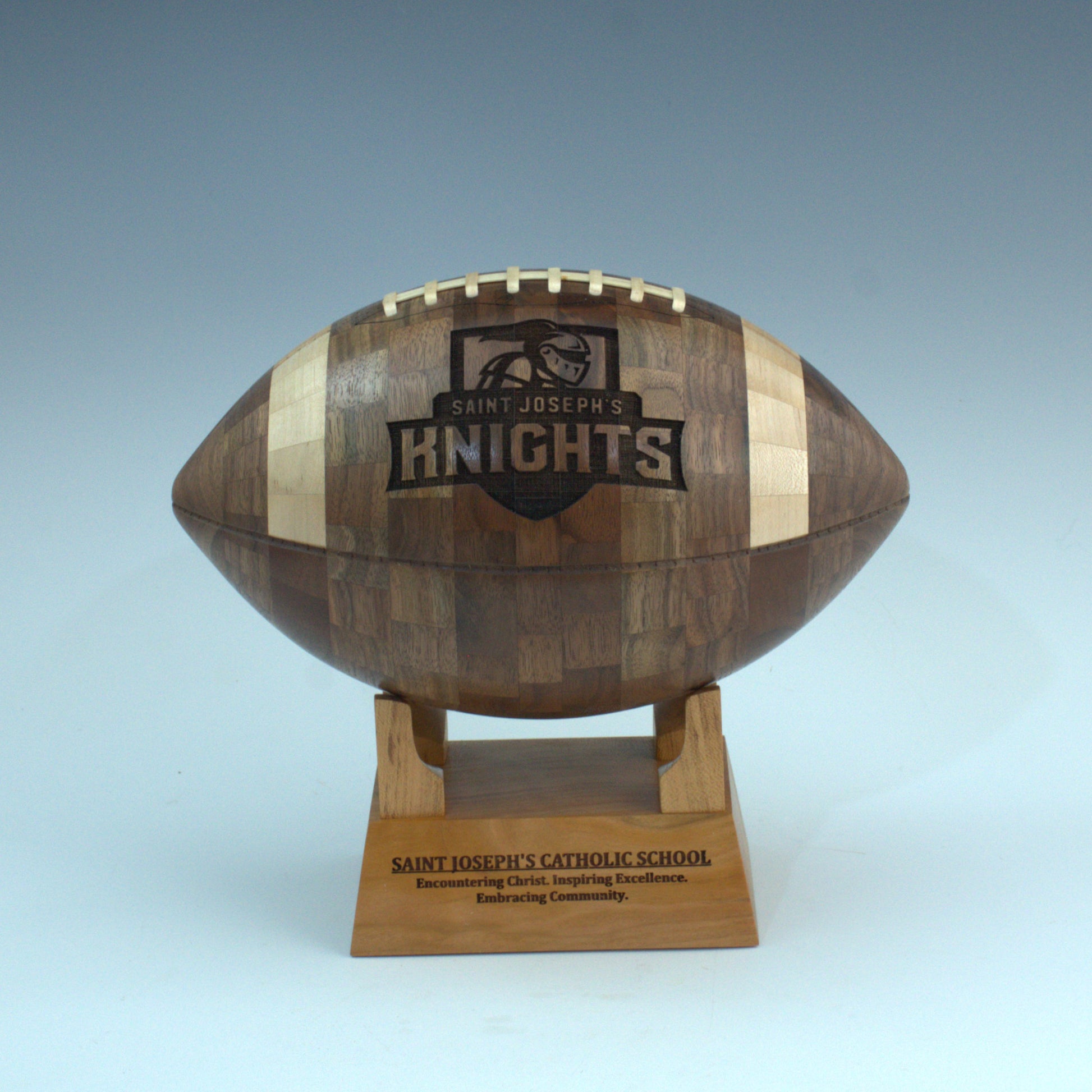 Wooden football trophy on a football 